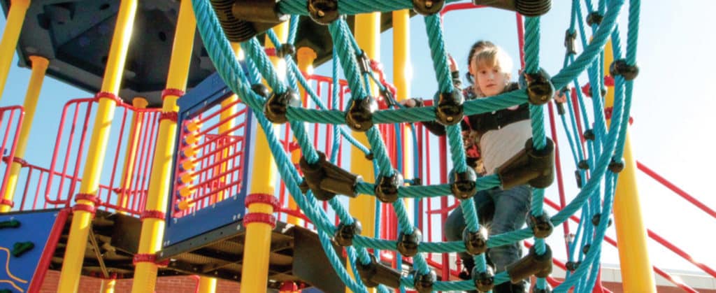 child climbing on rope net